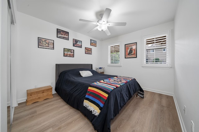 bedroom featuring light hardwood / wood-style floors and ceiling fan