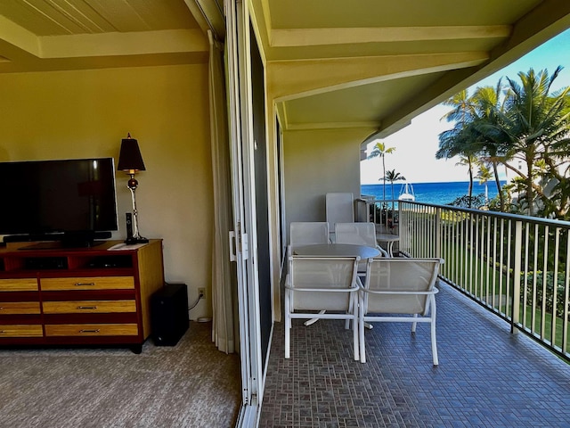 balcony featuring a water view