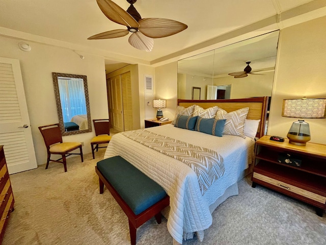 bedroom featuring ceiling fan, a closet, and carpet flooring