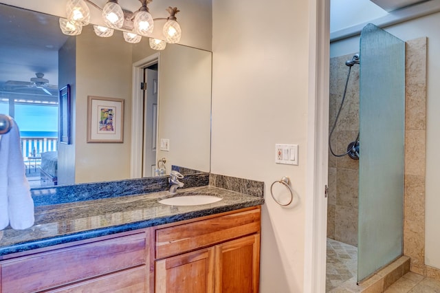 bathroom featuring vanity, ceiling fan, and an enclosed shower