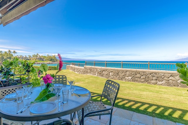 balcony with a patio area and a water view