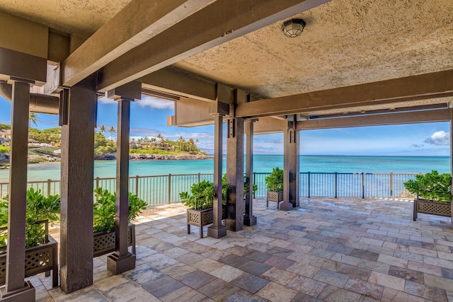 view of patio with a water view