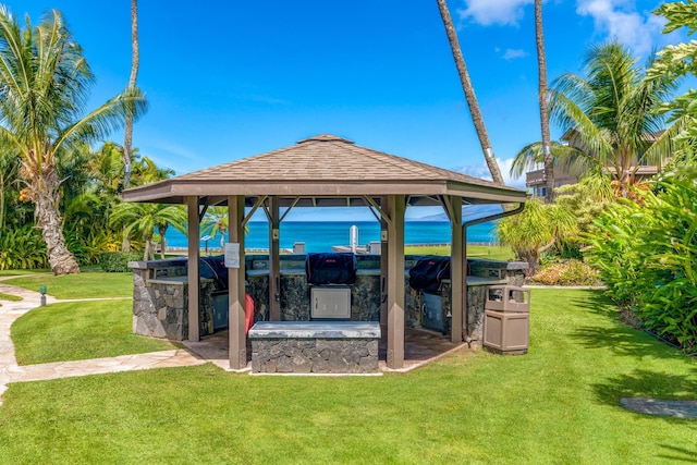 view of patio featuring a gazebo, a water view, and area for grilling