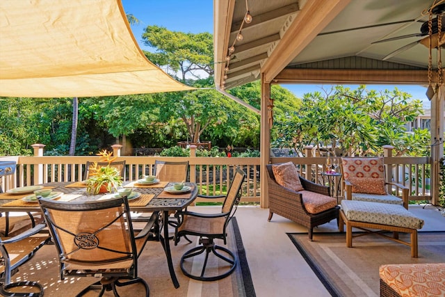 view of patio with outdoor dining space and ceiling fan