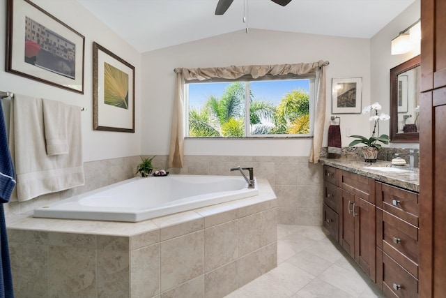 full bath with vanity, lofted ceiling, ceiling fan, tile patterned floors, and a bath