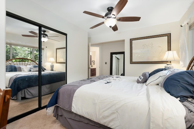 carpeted bedroom with a closet and ceiling fan