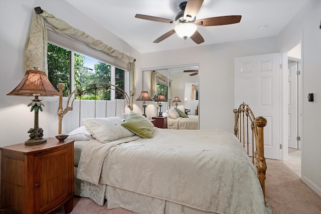 bedroom with a closet, carpet, and a ceiling fan