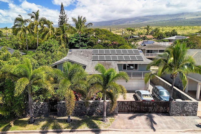 birds eye view of property featuring a mountain view