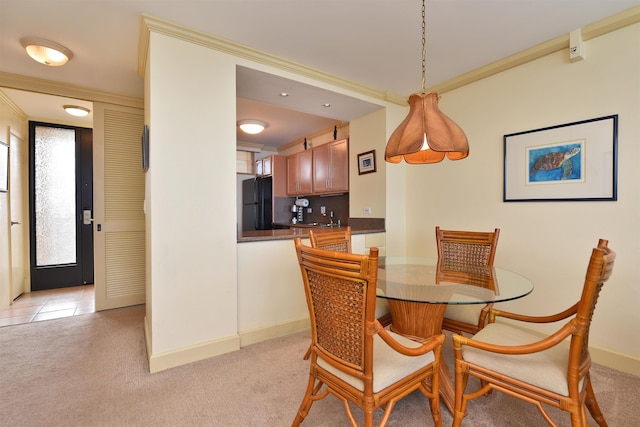 110 Kaanapali Shores Pl Unit 817, Lahaina, HI 96761 - dining area featuring light colored carpet, baseboards, and ornamental molding