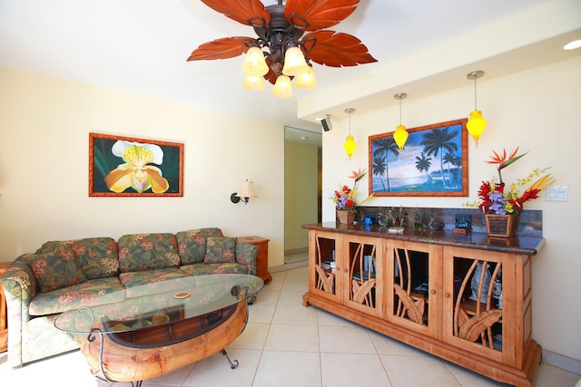 living room with light tile patterned floors and ceiling fan