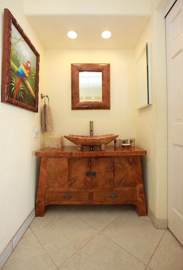 bathroom featuring tile patterned flooring and vanity