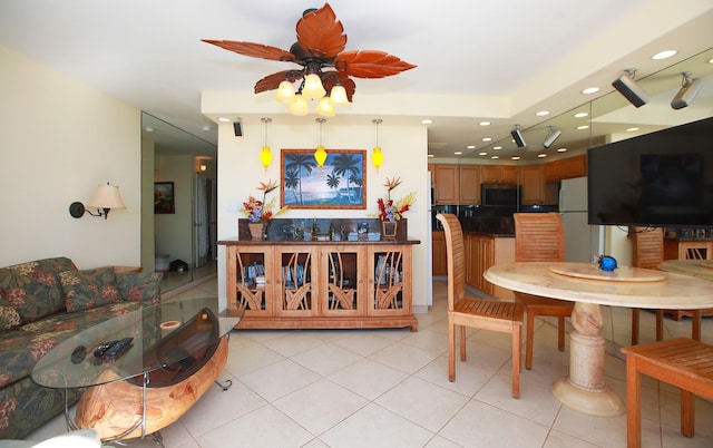 living room featuring ceiling fan and light tile patterned flooring