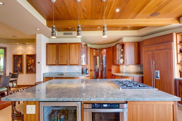 kitchen with wood ceiling, wine cooler, paneled fridge, stainless steel gas cooktop, and decorative light fixtures