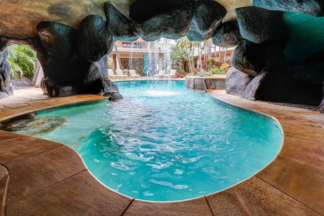 view of pool with pool water feature