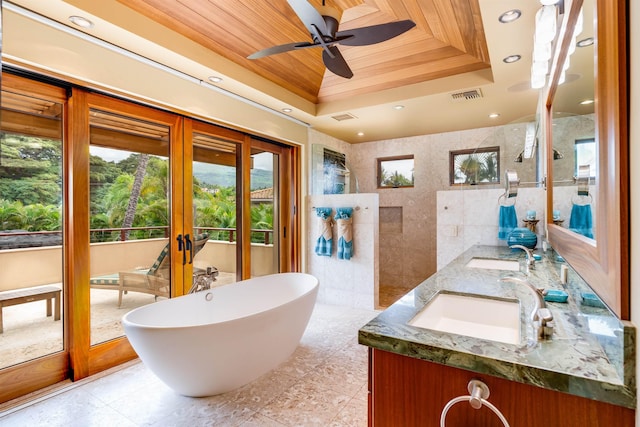 bathroom featuring wood ceiling, tile walls, vanity, french doors, and a raised ceiling