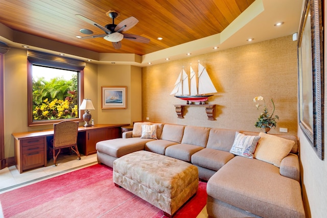 tiled living room featuring a tray ceiling, wooden ceiling, and ceiling fan