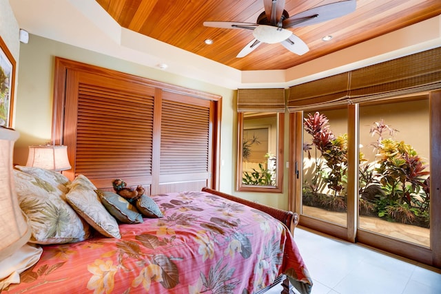 bedroom featuring a tray ceiling, wood ceiling, access to outside, and ceiling fan