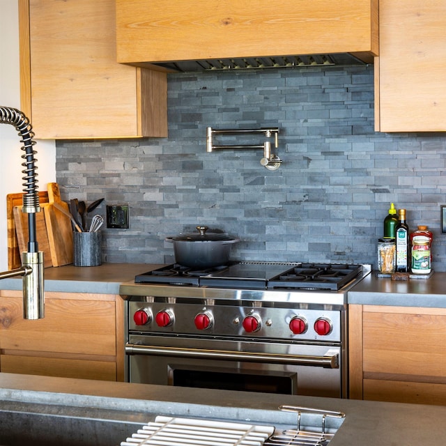 715 Laulama Pl Unit 45, Lahaina, HI 96761 - kitchen featuring stainless steel range, backsplash, and custom exhaust hood