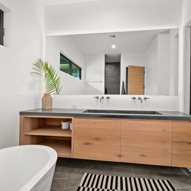 715 Laulama Pl Unit 45, Lahaina, HI 96761 - bathroom featuring a freestanding bath, double vanity, and recessed lighting