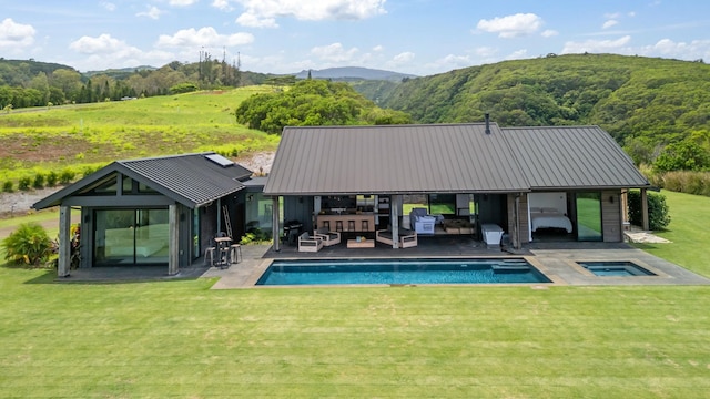715 Laulama Pl Unit 45, Lahaina, HI 96761 - outdoor pool featuring an in-ground hot tub, an outdoor hangout area, a yard, a patio, and a mountain view