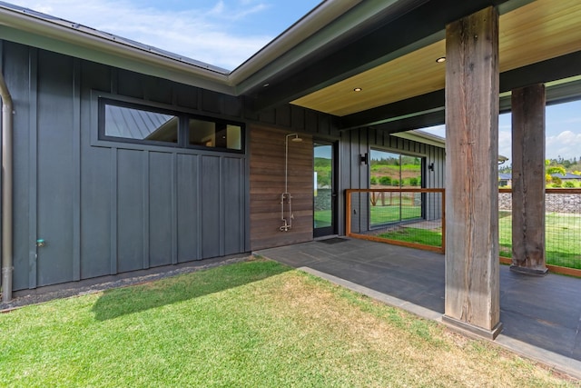 715 Laulama Pl Unit 45, Lahaina, HI 96761 - property entrance with board and batten siding and a yard