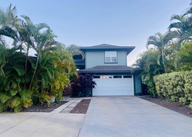 view of front of property featuring driveway and an attached garage