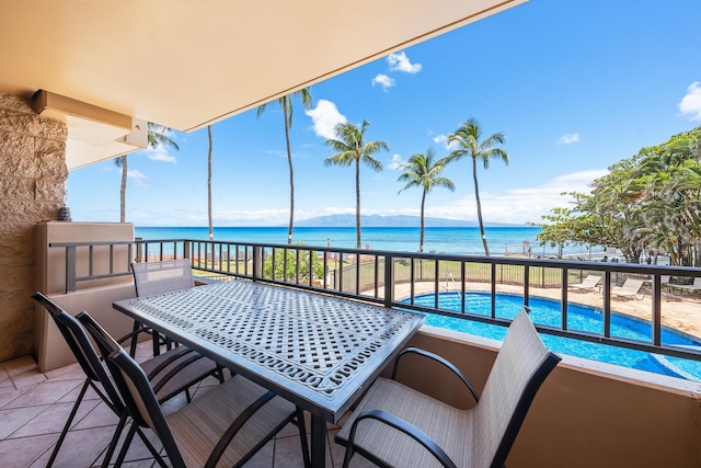 balcony featuring a water view