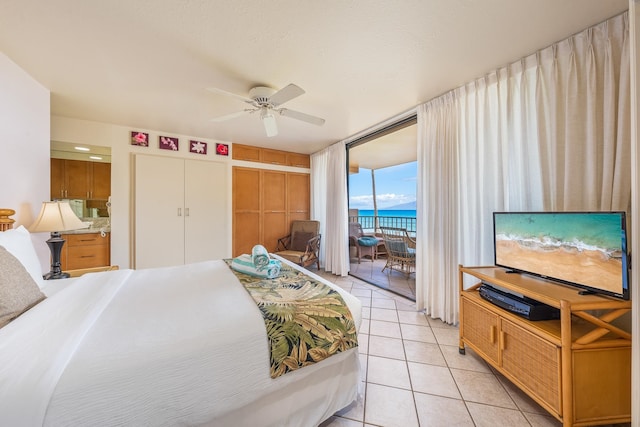 tiled bedroom featuring access to outside, a closet, and ceiling fan