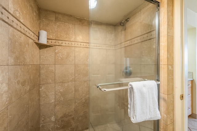 bathroom featuring a shower with door