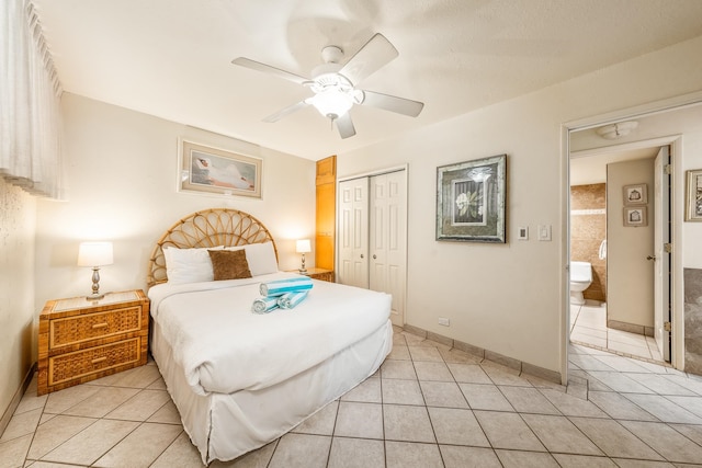 bedroom featuring ceiling fan, a closet, and light tile patterned floors