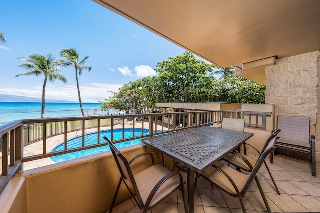 balcony featuring a water view