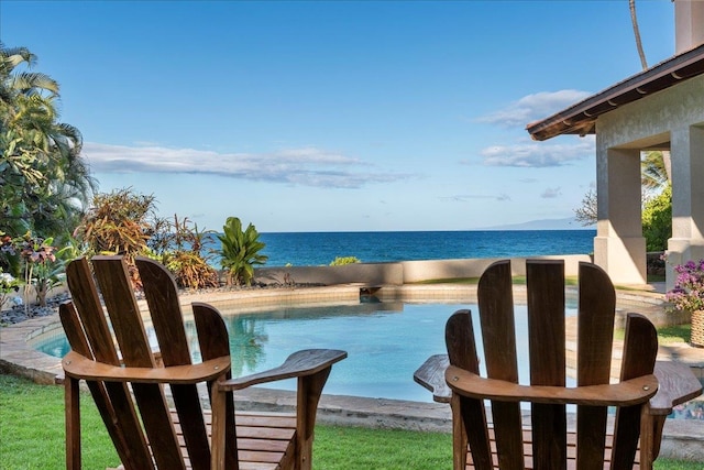 view of swimming pool with a water view