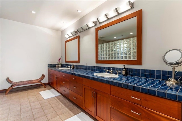 bathroom with tile flooring and double sink vanity