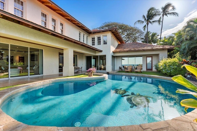 view of swimming pool with a patio