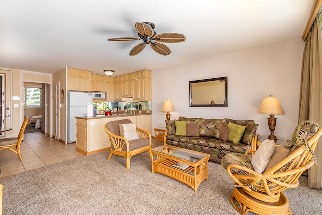 tiled living room with ceiling fan