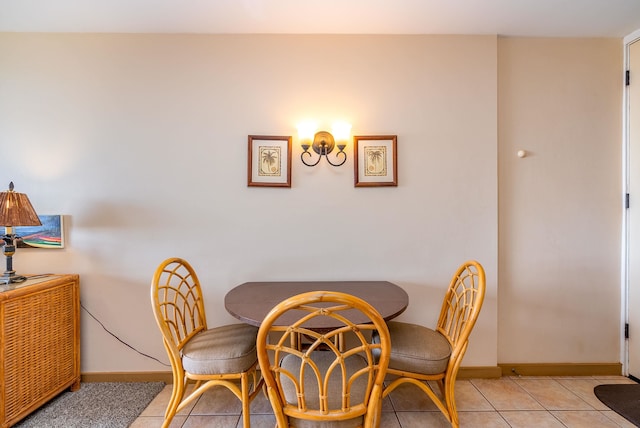 dining area with light tile patterned floors