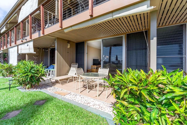 rear view of property featuring a patio area