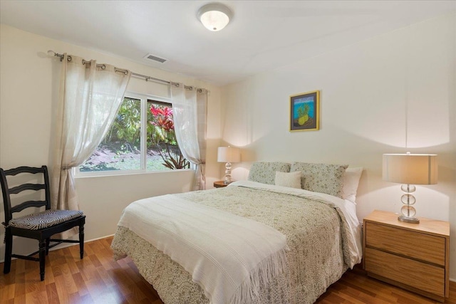 bedroom featuring dark hardwood / wood-style floors