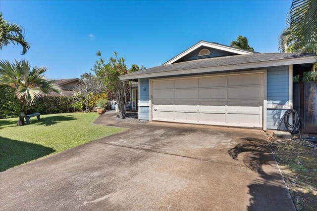 garage with a lawn