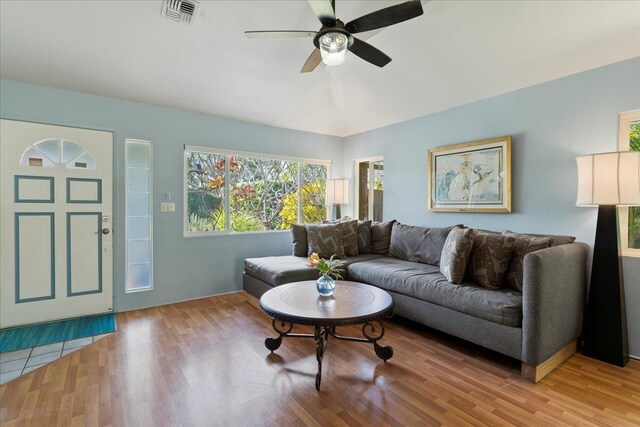 living room with ceiling fan and hardwood / wood-style flooring