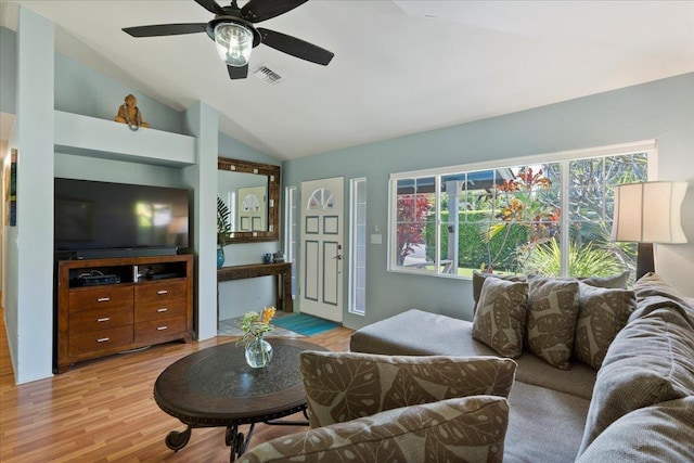 living room with light hardwood / wood-style floors, lofted ceiling, and ceiling fan