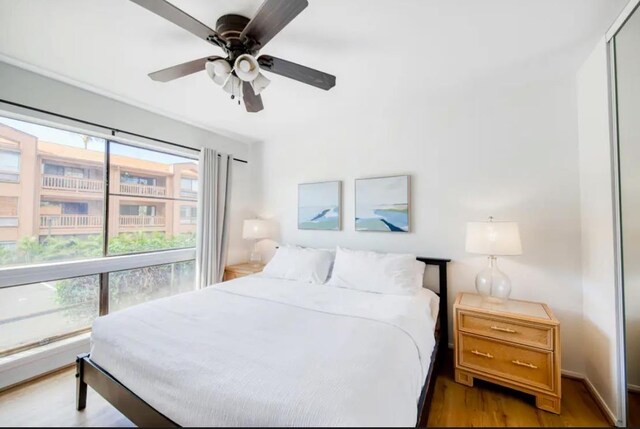 3740 Lower Honoapiilani Rd Unit B103, Lahaina, HI 96761 - bedroom with wood finished floors and a ceiling fan