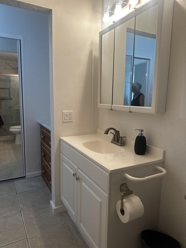 715 S Kihei Rd Unit D143, Kihei, HI 96753 - full bathroom with toilet, vanity, tile patterned floors, and tiled shower