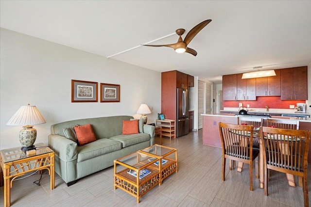living area with ceiling fan