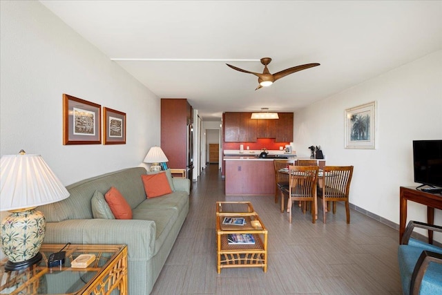 living area with ceiling fan