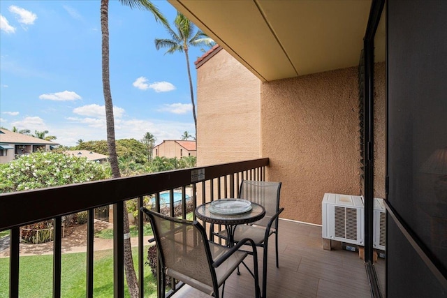 balcony featuring a wall mounted air conditioner