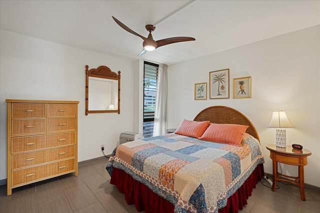 bedroom featuring baseboards and a ceiling fan