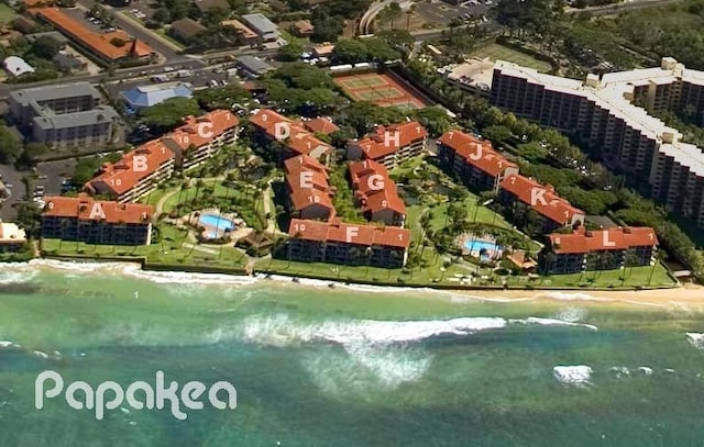 birds eye view of property with a water view