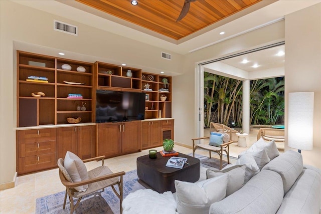 tiled living room with ceiling fan and wooden ceiling