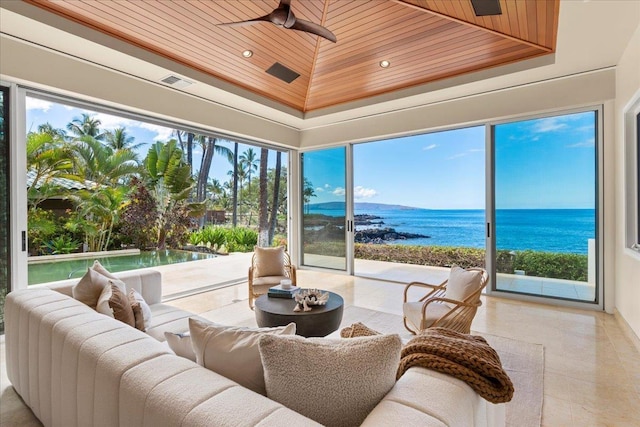 sunroom with a water view, a healthy amount of sunlight, and wood ceiling